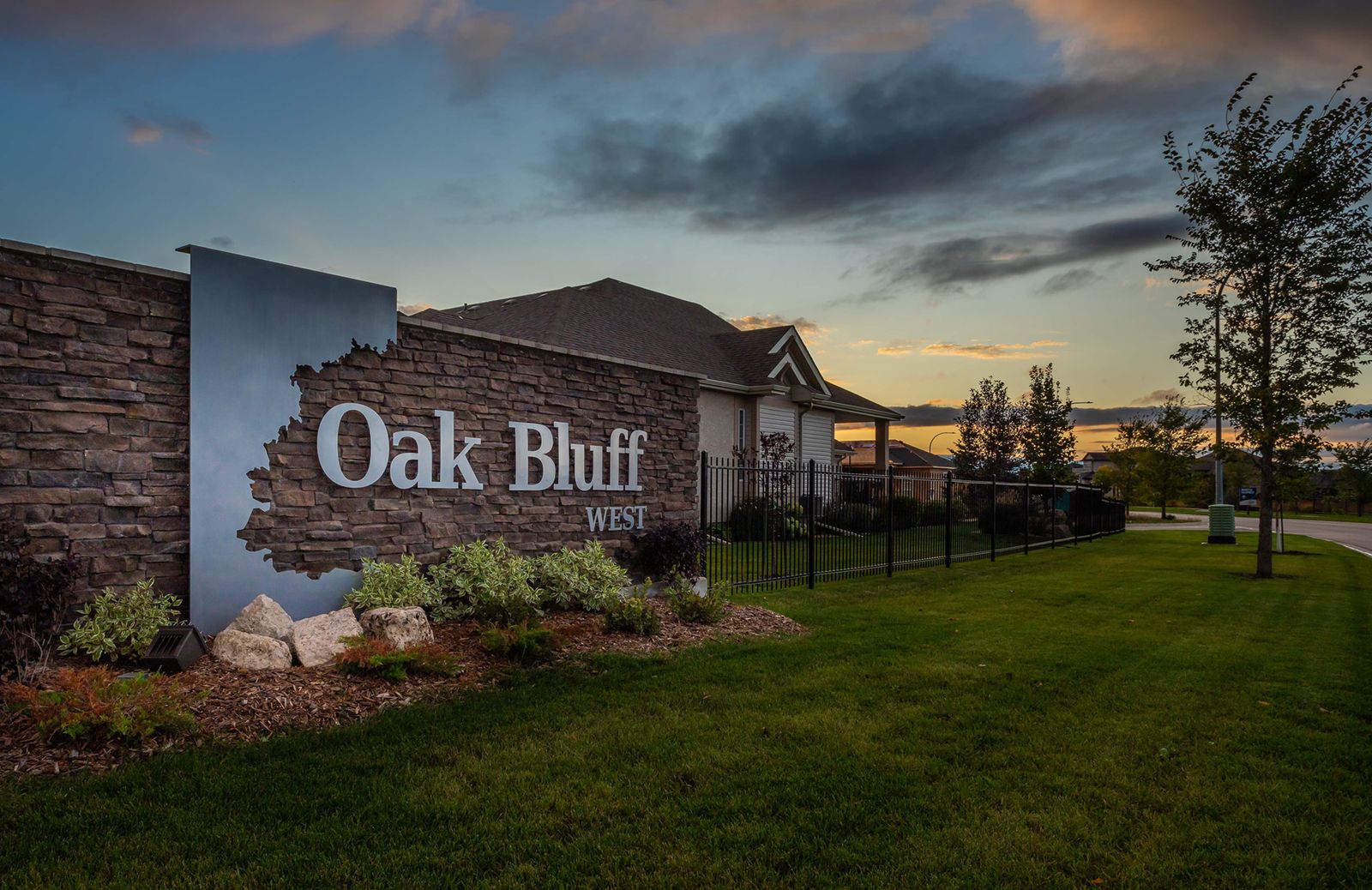 Oak Bluff West community sign at sunset