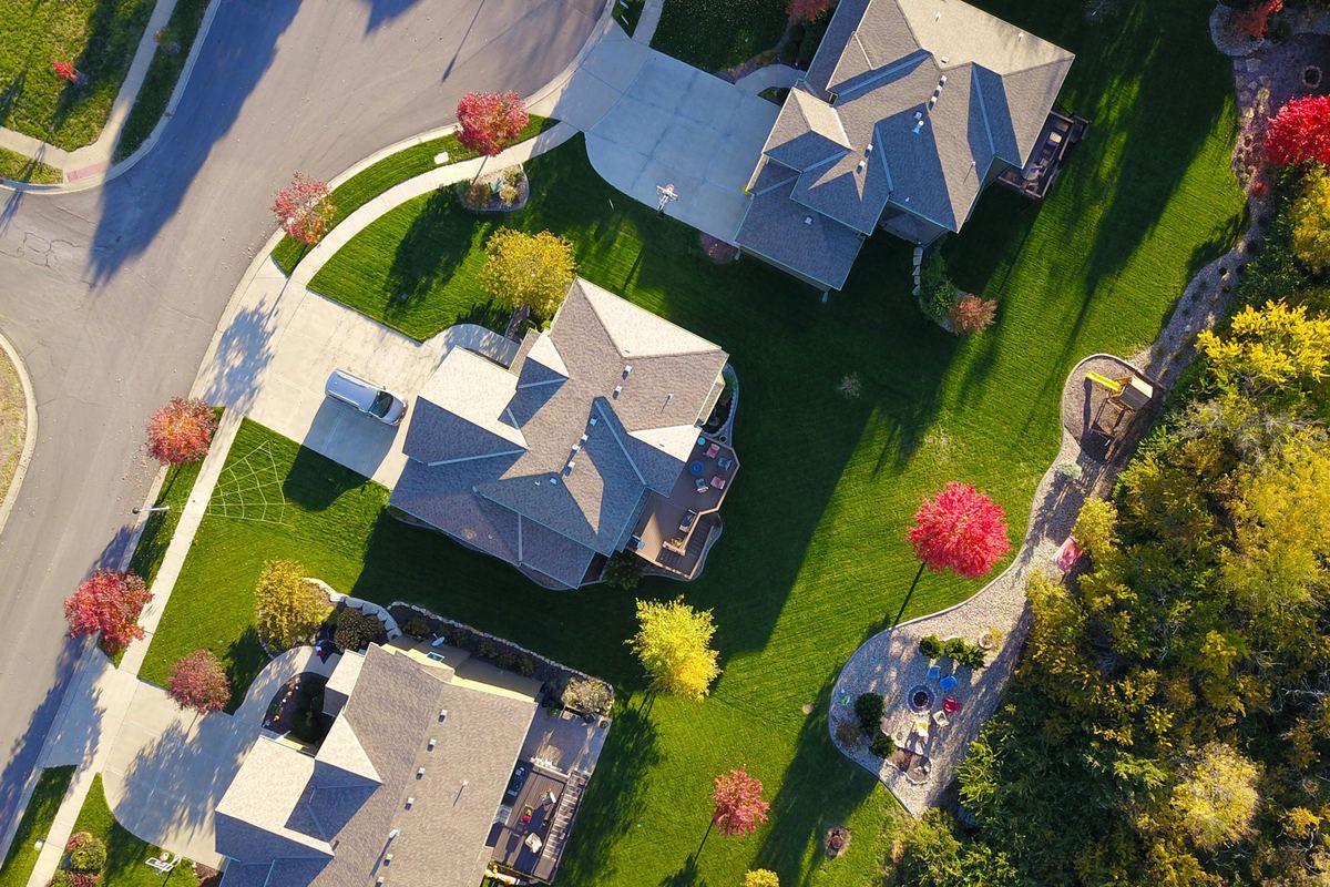Aerial view of neighbouring homes on a curved residential street
