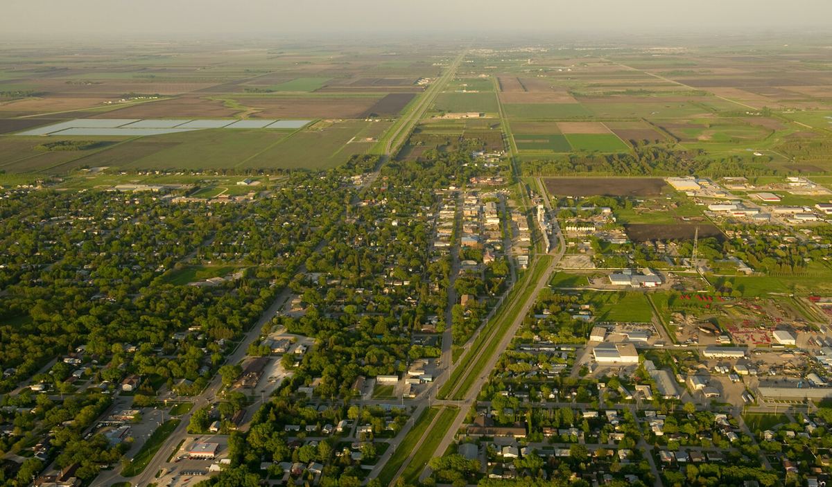Aerial view of a small Southern Manitoba town surrounded by farmland